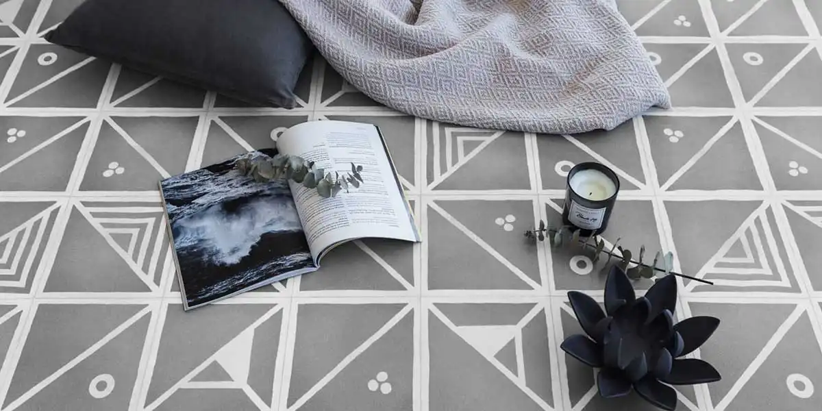 Handcrafted Dash Dash Dot design tiles adorned with book, candle, and flowers for exquisite décor. 